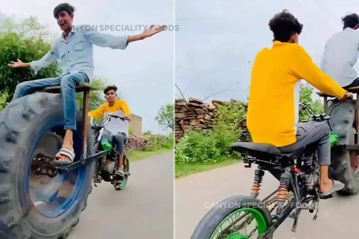 man-put-tractor-wheel-in-front-of-bike